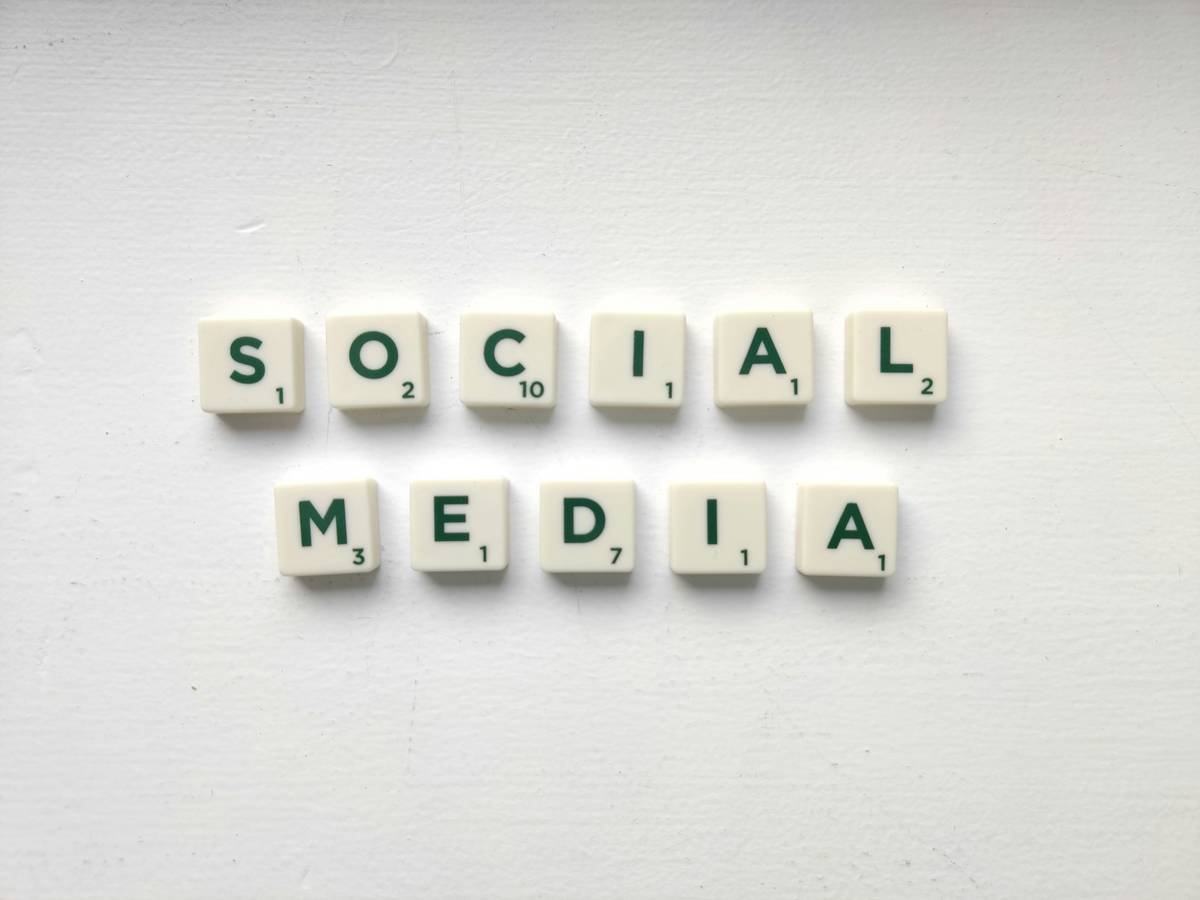 Social media worlds on the white table. Want to know more about social media marketing? Read on: www.hookle.net/post/what-is-social-media-marketing-and-why-is-it-important-for-small-businesses