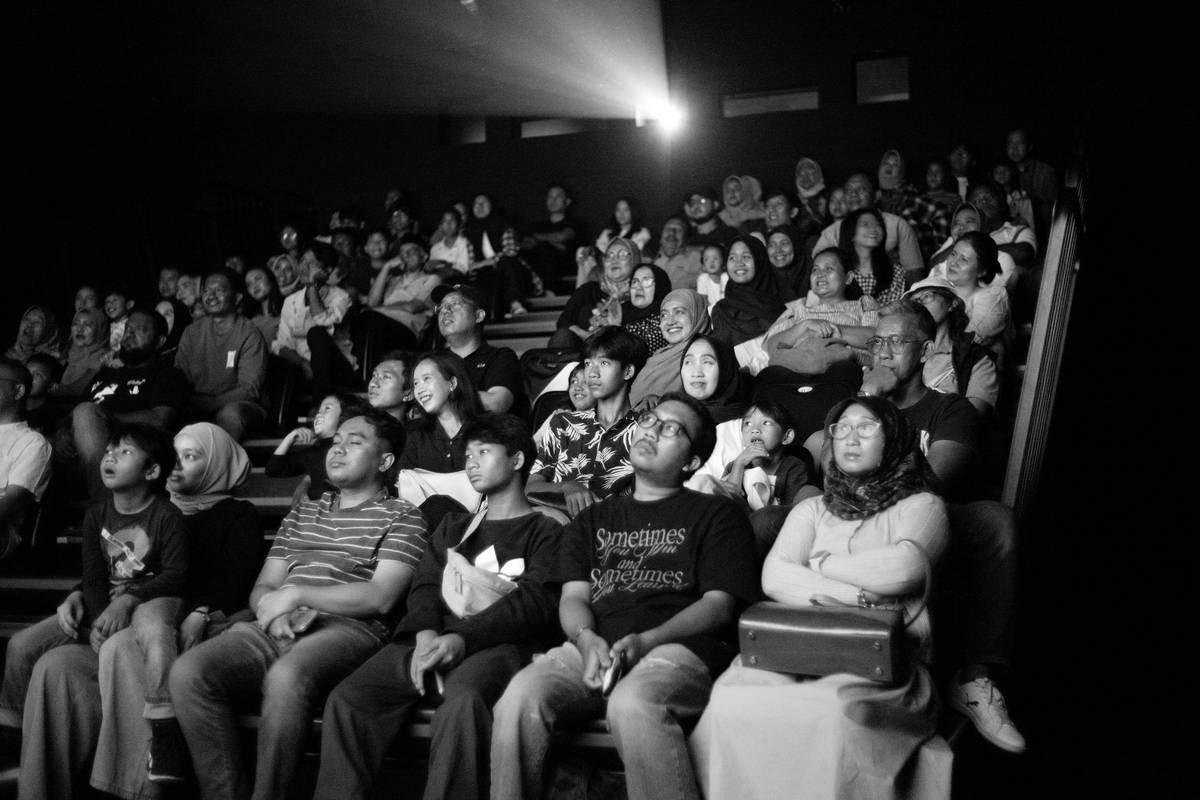 A black and white photo of a crowd of people