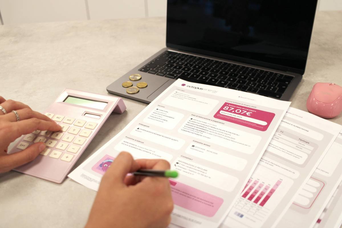 Small business owner implementing content strategy management social media job using smartphone and notebook